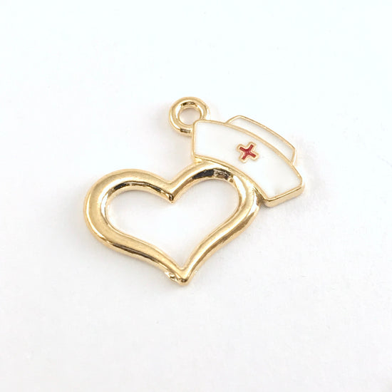 gold and white jewerly charm that looks like a nurse hat on a heart