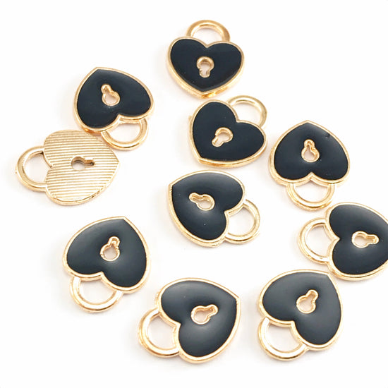 black and gold colour jewelry charms that are shaped like locks with a keyhole