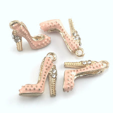 pink and gold colour jewerly charms that look like high heel shoes