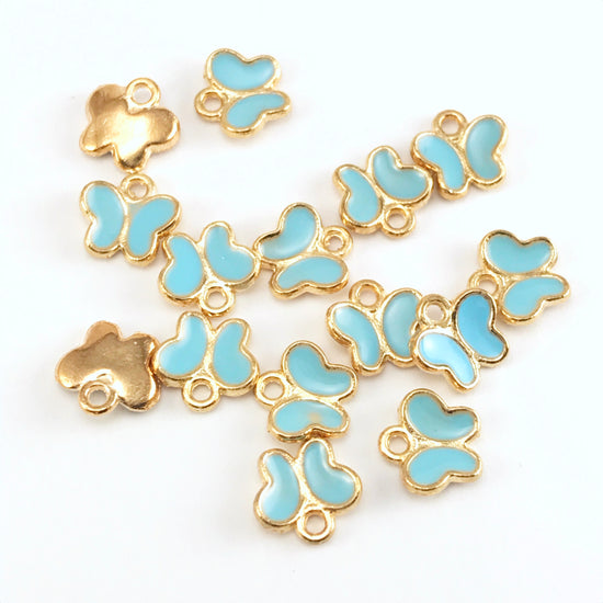 blue and gold colour jewerly charms that look like butterflies