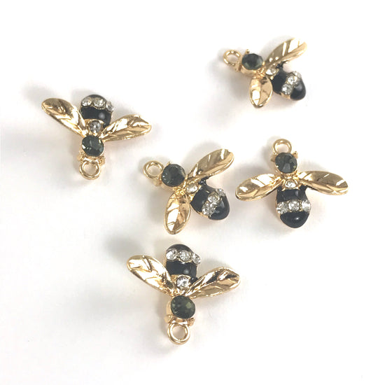 black and gold jewelry charms shaped like bees