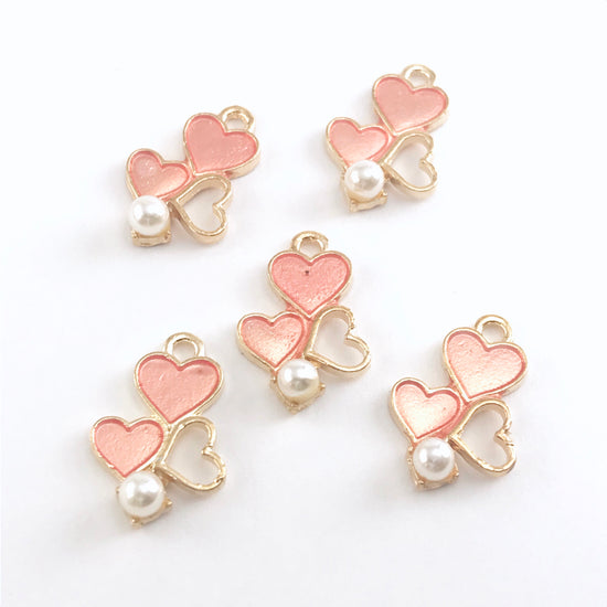 pink and gold heart shaped jewelry charms