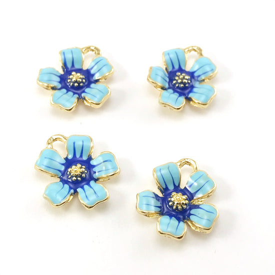 flower shaped jewelry charms that are gold, light blue and dark blue