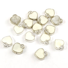 white and silver heart shaped jewerly charms