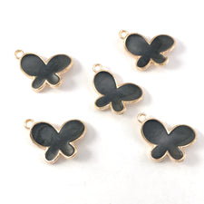 black and gold colour jewerly charms shaped like butterflies