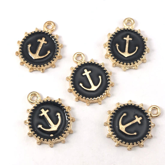 black and gold colour jewelry charms that look like anchors