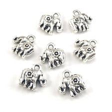 silver colour jewerly charms that look like elephants