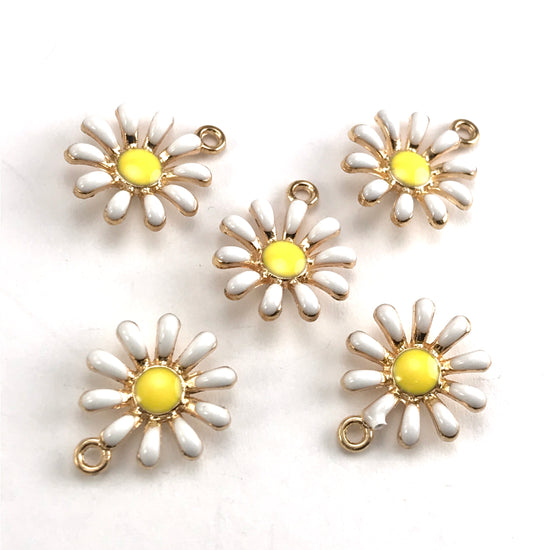 white yellow and gold colour jewerly charms that look like daisies