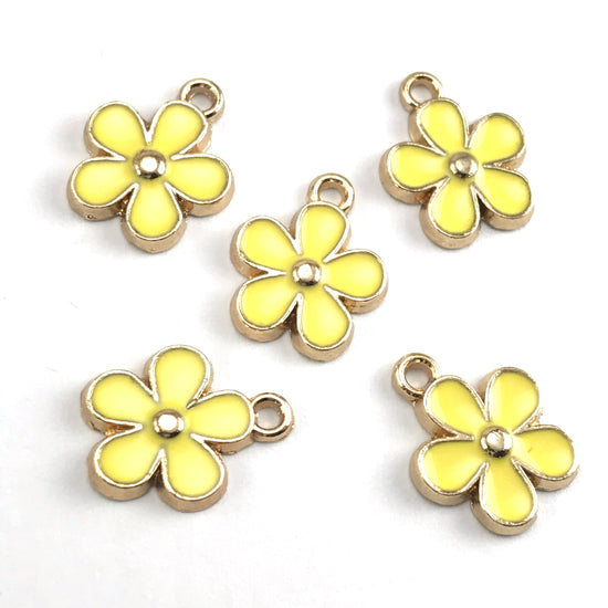 yellow and gold colour jewerly charms that look like flowers