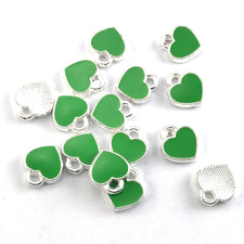green and silver heart shaped jewerly charms