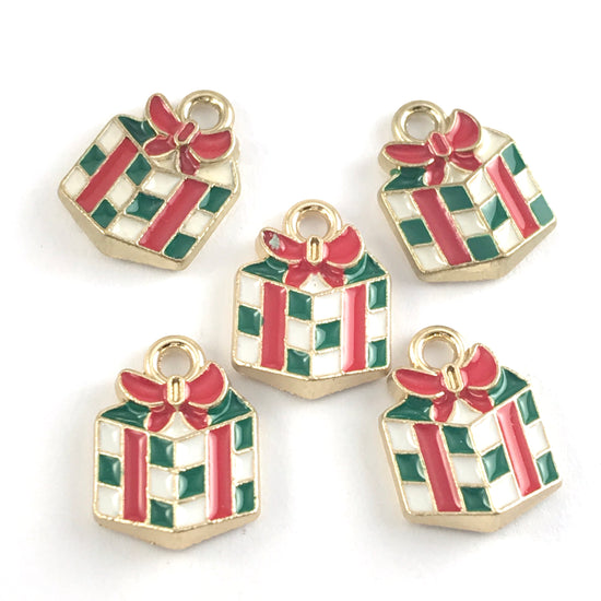green white and red jewerly charms shapped like wrapped christmas gifts