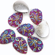 purple teardrop shaped cabochons with flower embellishments