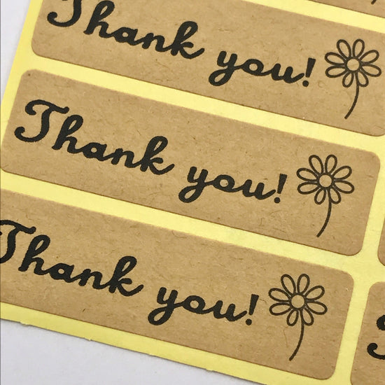 close up of craft paper sticker with Thank You printed on them