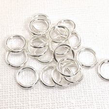 Pile of silver color jewelry jump rings