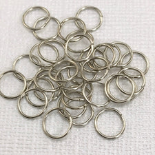 pile of silver color open jump rings
