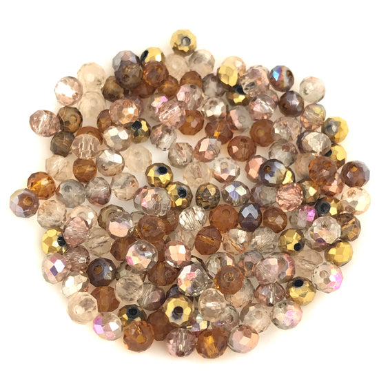 rondelle shaped jewerely beads that are a mix of gold and beige colours