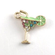gold and green jewerly pendant that looks like a lime margarita glass