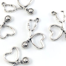 silver jewelry charms shaped like stethescopes