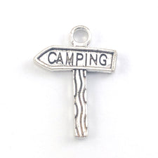 silver jewelry charm that looks like a sign with the word camping on it