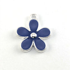 silver and blue flower shaped jewelry charm