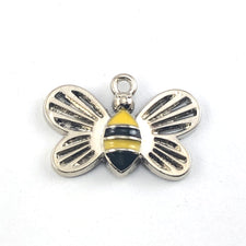bee shaped charms that are silver, black and yellow