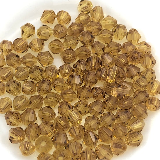 Amber colour bicone shaped beads
