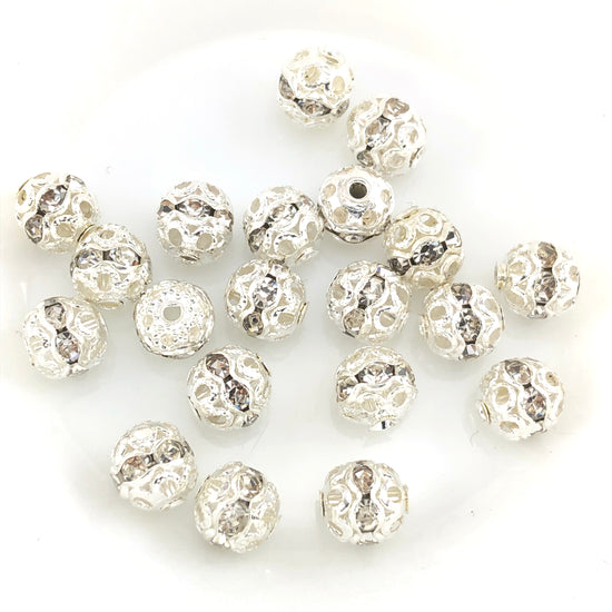 round beads that are silver with clear rhinestones