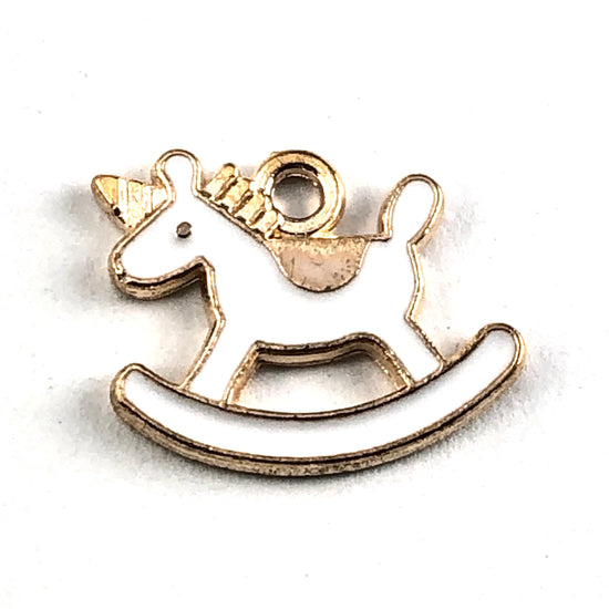 white and gold colour jewerly charms shaped like rocking horses