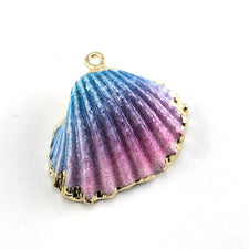 seashell painted pink, blue and gold