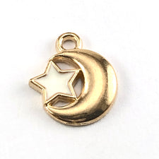 jewerly charms that are a gold moon with a white star attached