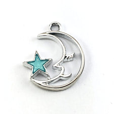 silver moon shaped jewerly charm with blue star attached