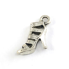 silver jewerly charm that looks like a high heel shoe