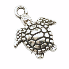 silver jewelry charm that looks like a turtle