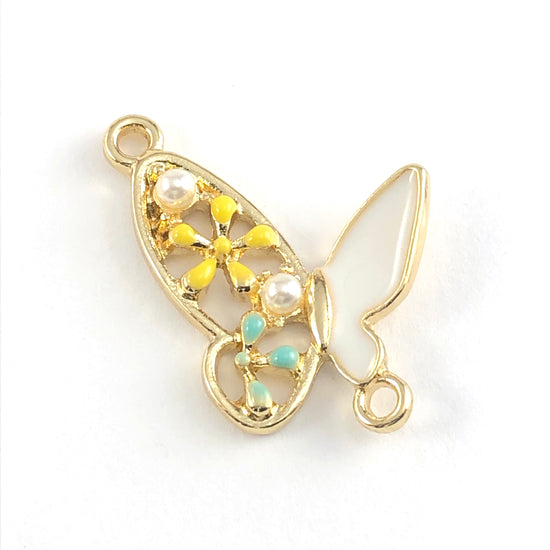 Butterfly shaped pendant that is gold, yellow, blue, and white
