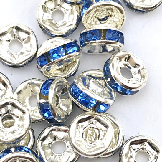 pile of silver and cobalt blue color rondelle jewelry beads