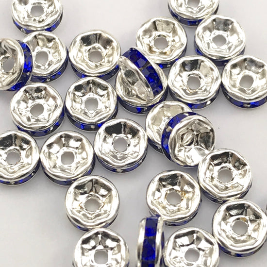 pile of silver and blue color rondelle jewelry beads