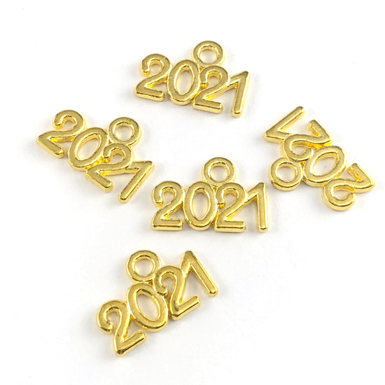 gold colour jewerly charms in the shape of 2021