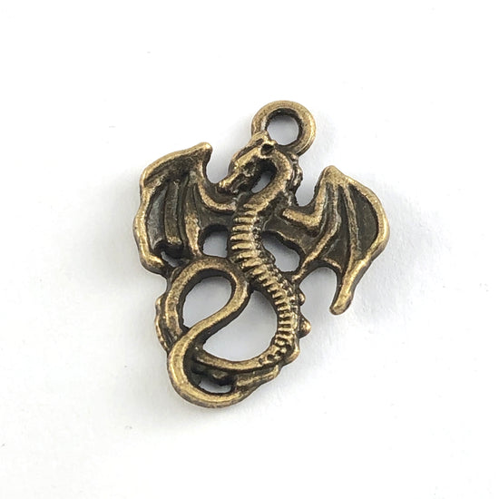 antique bronze coloured jewerly pendant that looks like a dragon
