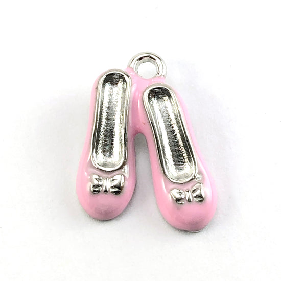 pink and silver jewerly charms that look like shoes