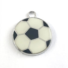 white black and silver jewerly charm that looks like a soccer ball