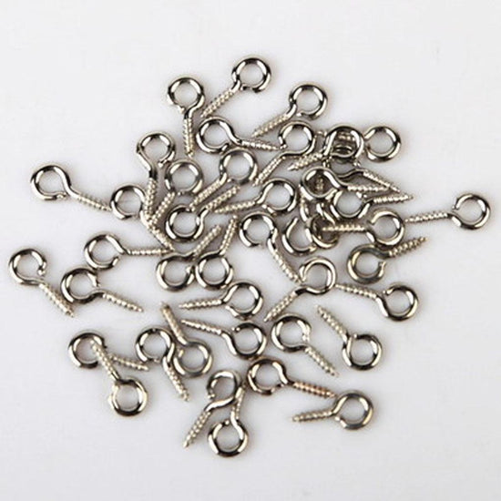 pile of eye screws silver color