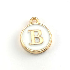 Round white and gold jewerly charm of the letter B
