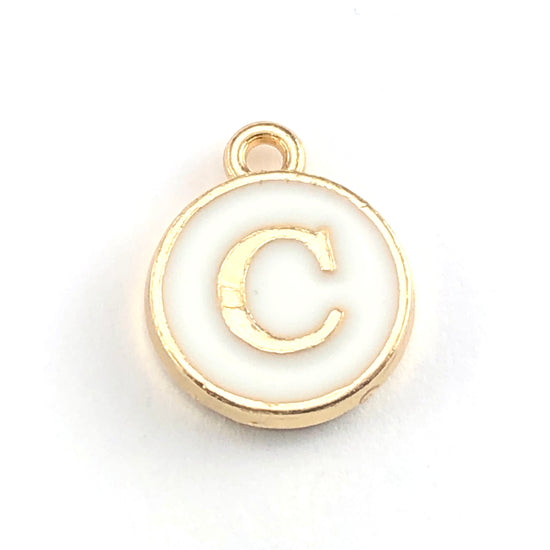 Round white and gold jewerly charm of the letter C