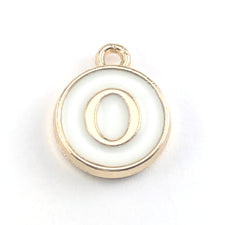 round white and gold jewerly charms with the letter O on them