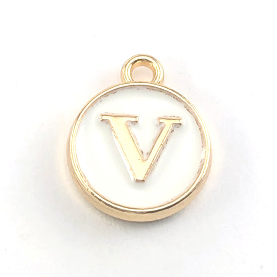 gold and white round jewerly charms with the letter V on them