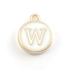 round white and gold jewerly charms with the letter W on them