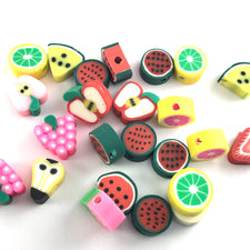 jewerly beads that are shaped like assorted fruits