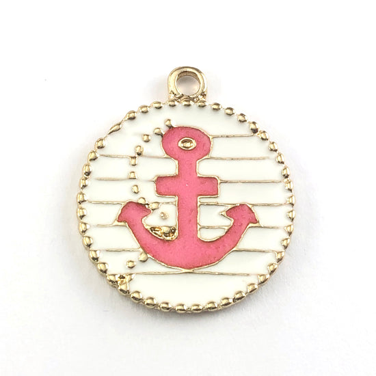 round pink gold and white jewerly charm with an anchor shaped image on it