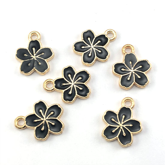 gold and black flower shaped jewerly charms