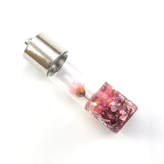 clear glass pendant with pink flower inside